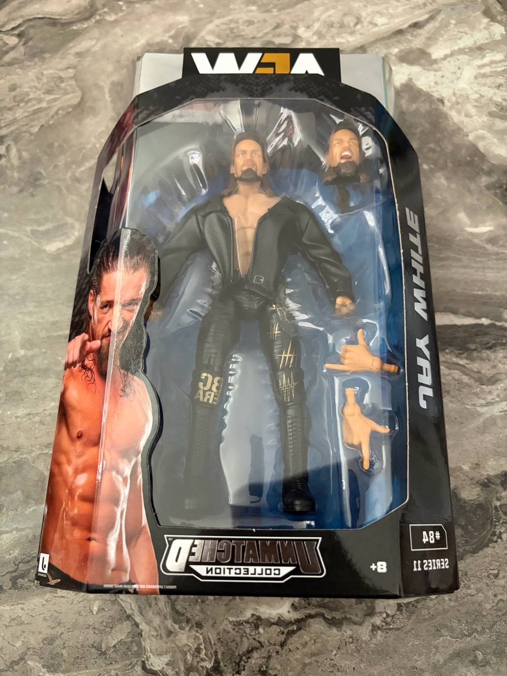 WWE Action Figure - Black Outfit with Blue Backing